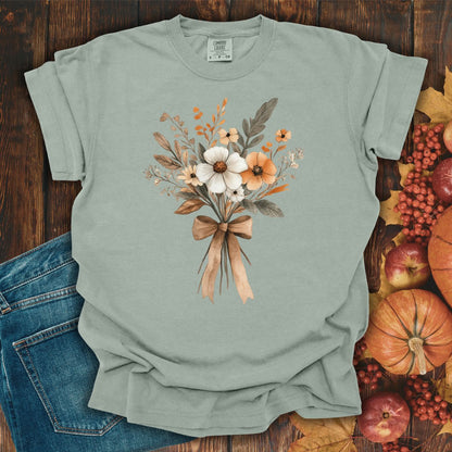 Relaxed-fit Bay green t-shirt with a watercolor Harvest Bouquet design and a brown ribbon.