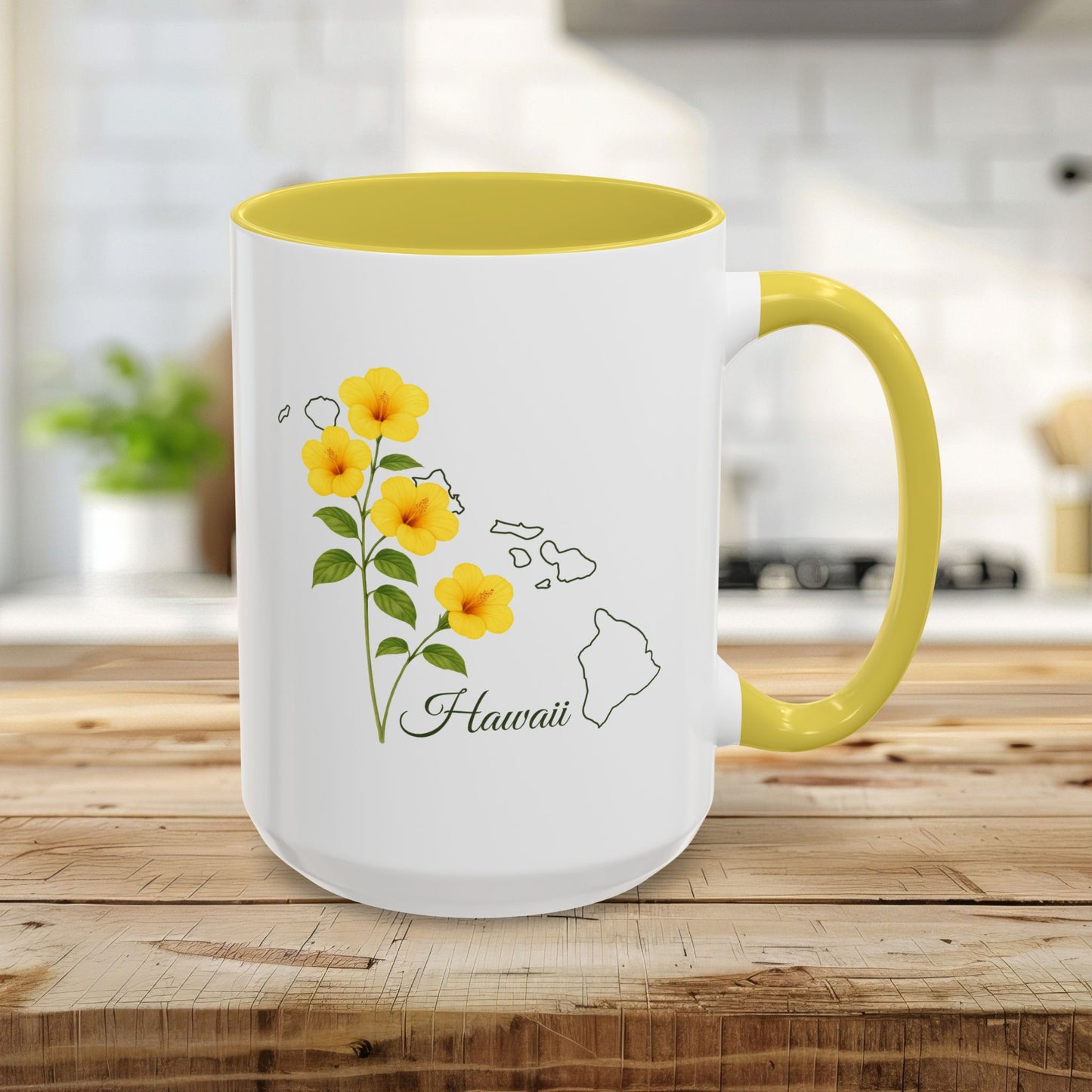 15oz white ceramic mug with yellow hibiscus, Hawaii outline, and yellow interior/handle on a wooden table.
