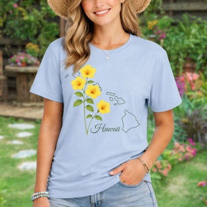 Woman in a light blue t-shirt with yellow hibiscus flowers and a Hawaii map outline.