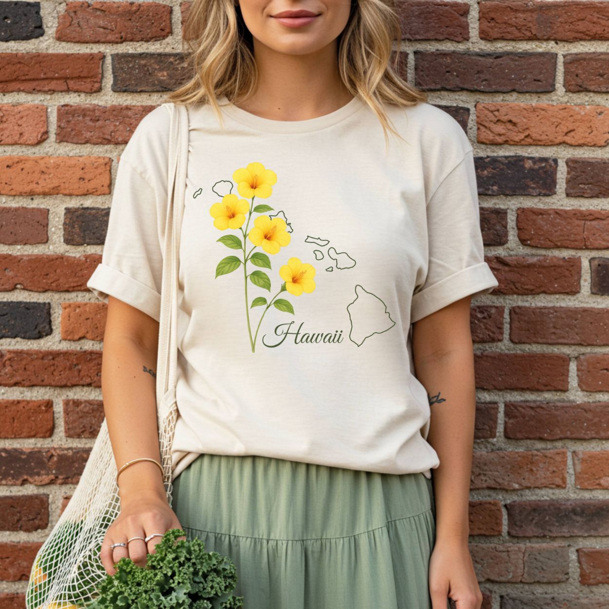 Relaxed-fit, garment-dyed t-shirt with yellow hibiscus and Hawaii island outline.