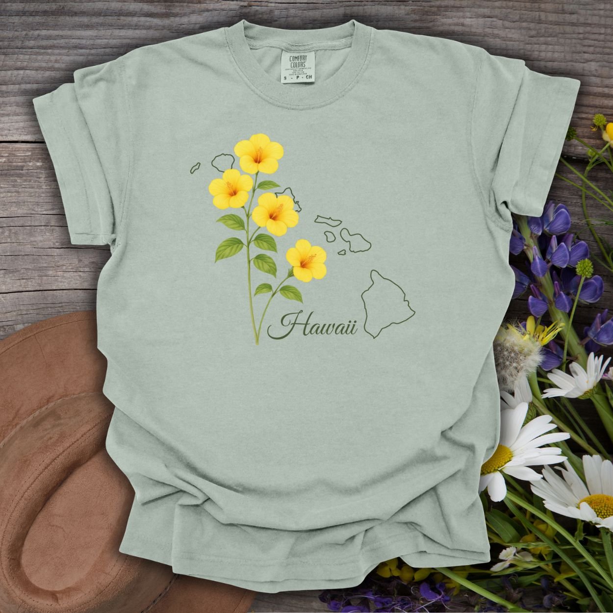 Bay-colored, relaxed-fit cotton tee with yellow hibiscus flowers and a Hawaii island outline.