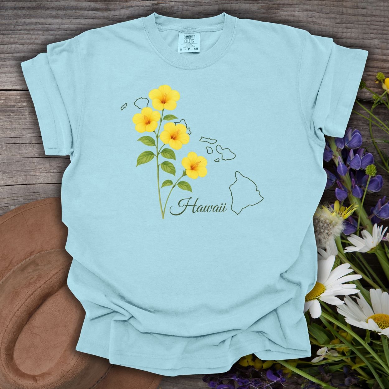 Chambray S t-shirt with yellow hibiscus flowers and a subtle outline of the Hawaiian islands.
