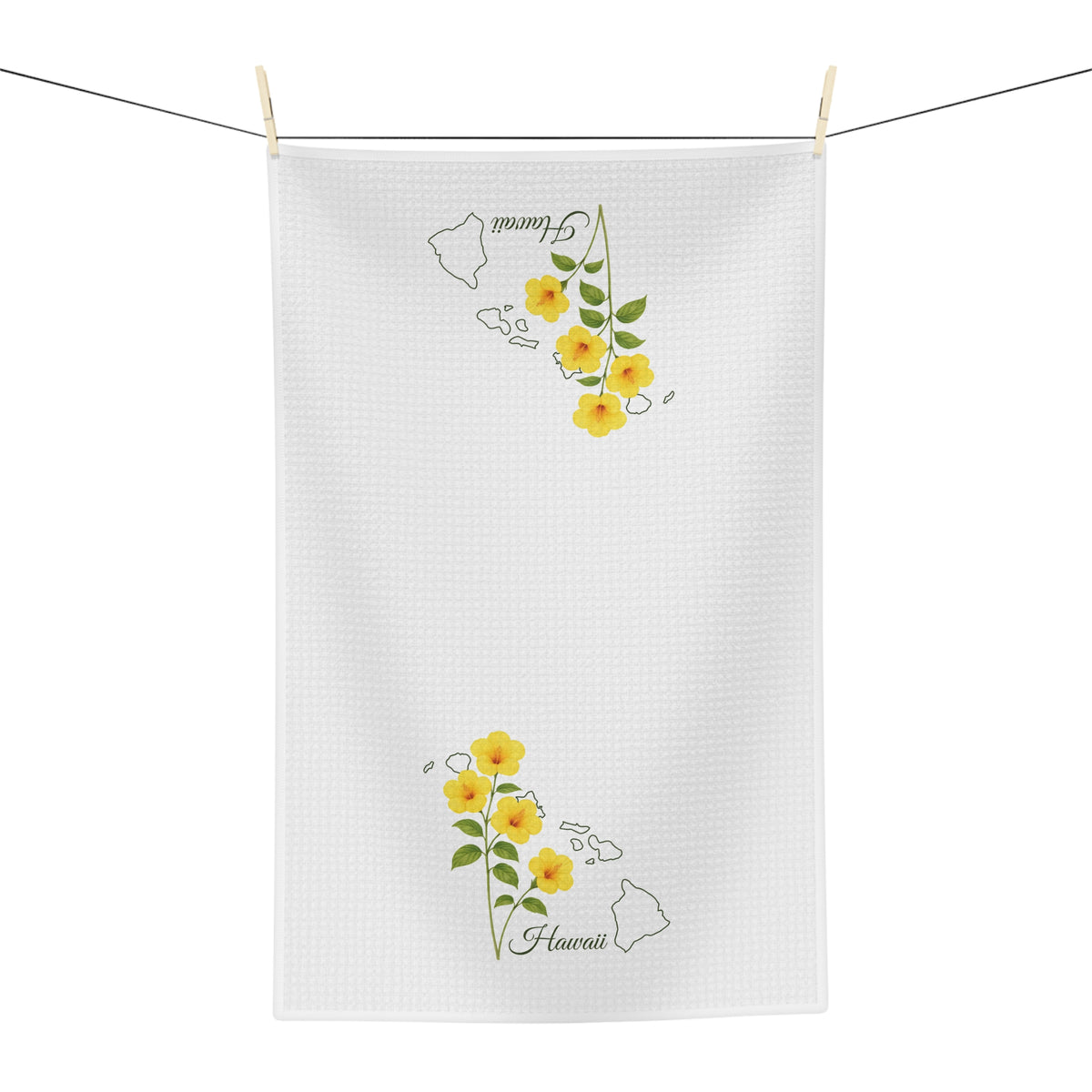 White microfiber tea towel with yellow hibiscus flowers and a subtle Hawaii map design.