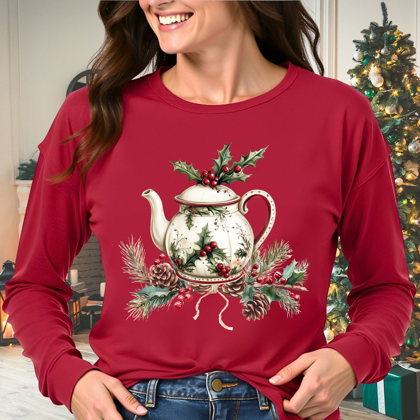 Red long-sleeve tee with a watercolor Christmas teapot and holly design.