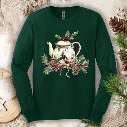 Forest Green long-sleeve tee with a watercolor Christmas teapot, holly, and pinecone design.