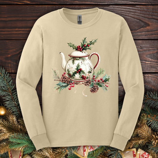 Sand long-sleeve tee with watercolor Christmas teapot, holly, and pinecone design.