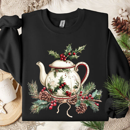 Black Gildan sweatshirt with a vintage Christmas teapot, holly, and pinecone design.