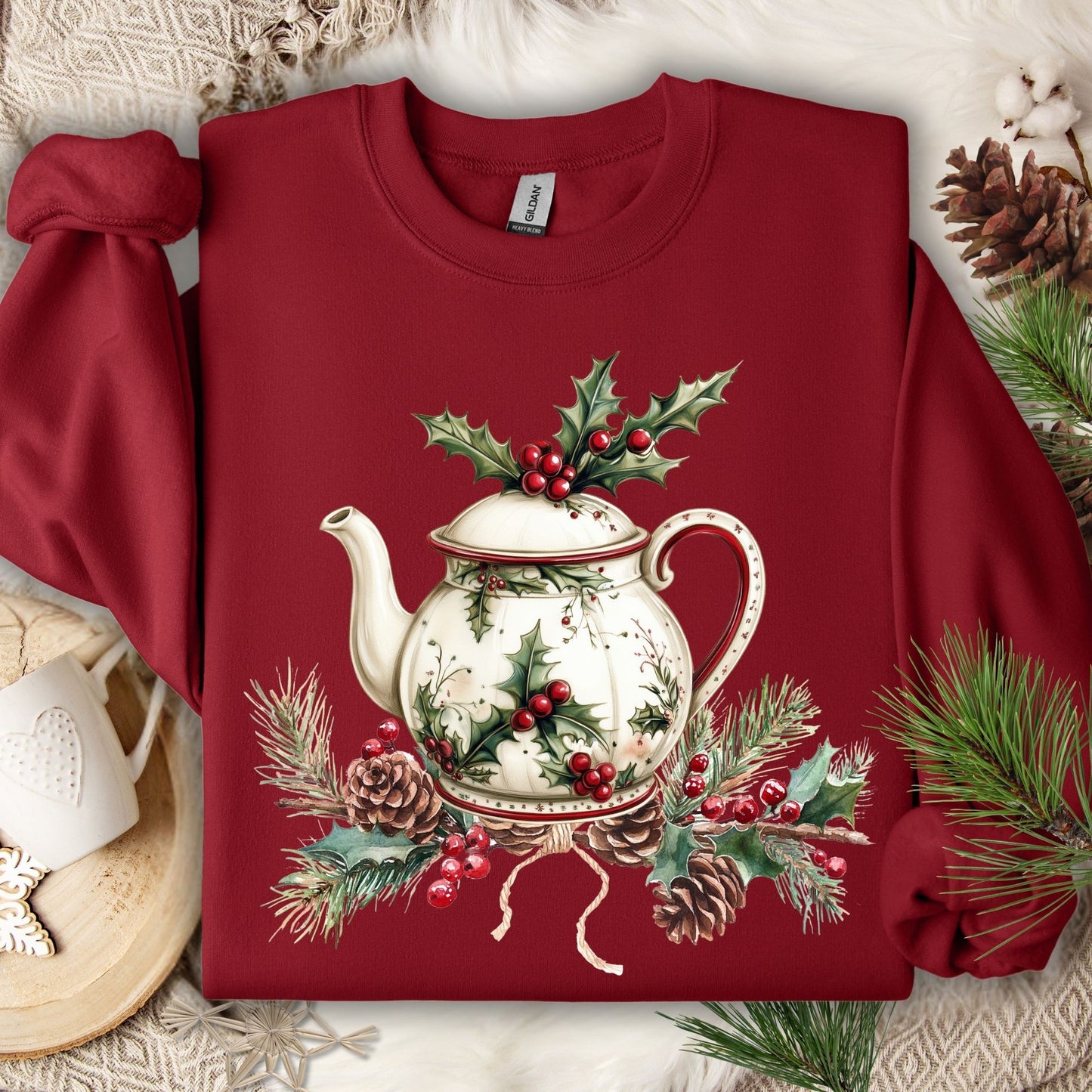Cardinal Red Gildan sweatshirt with a vintage Christmas teapot, holly, and pinecone design.