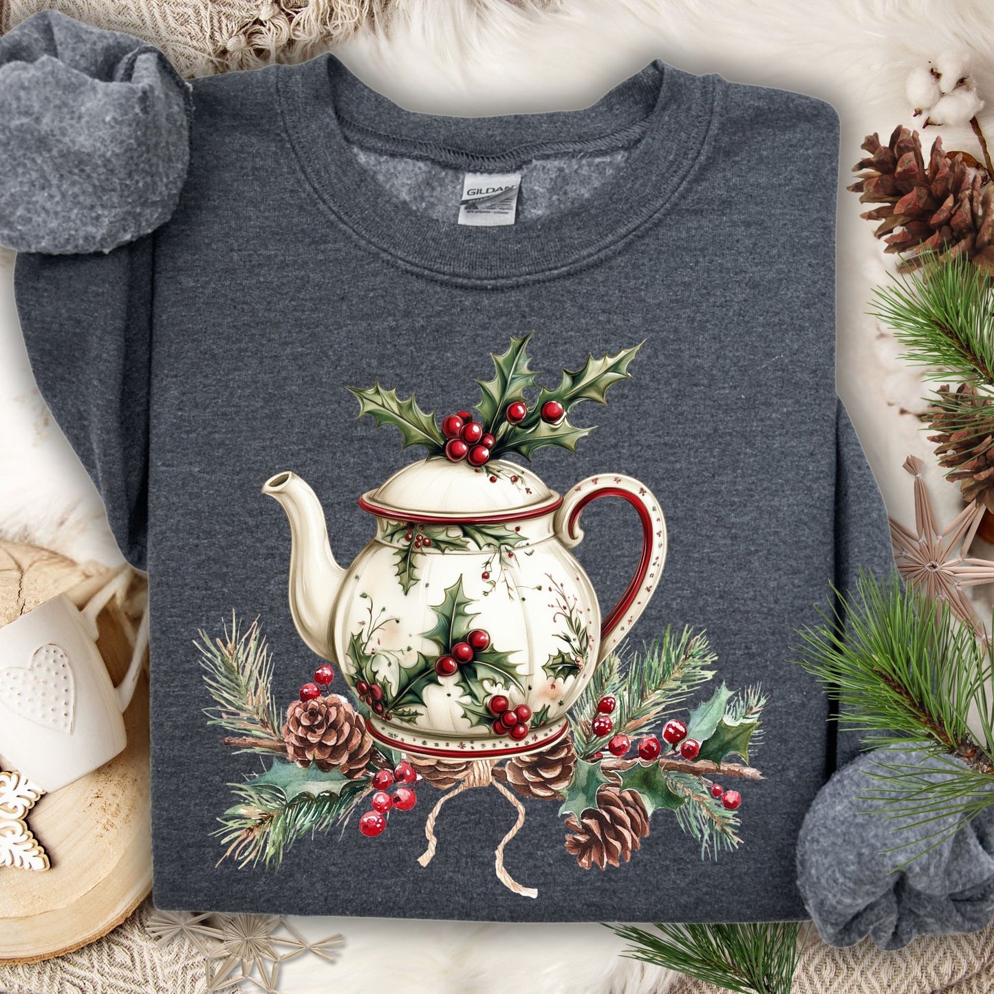 Dark Heather Gildan sweatshirt with a vintage Christmas teapot, holly, and pinecone design.