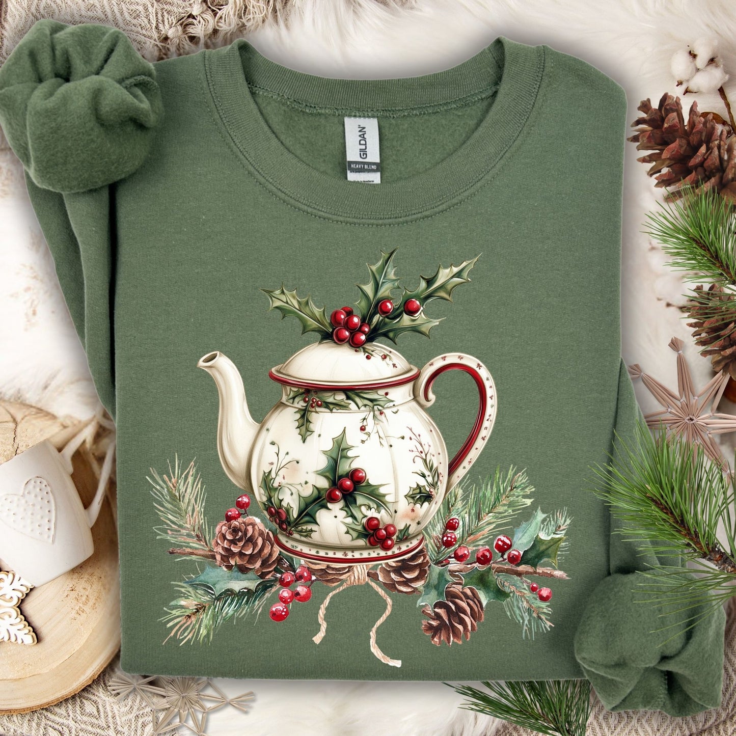 Military Green Gildan sweatshirt with a vintage Christmas teapot, holly, pine, and berries design.