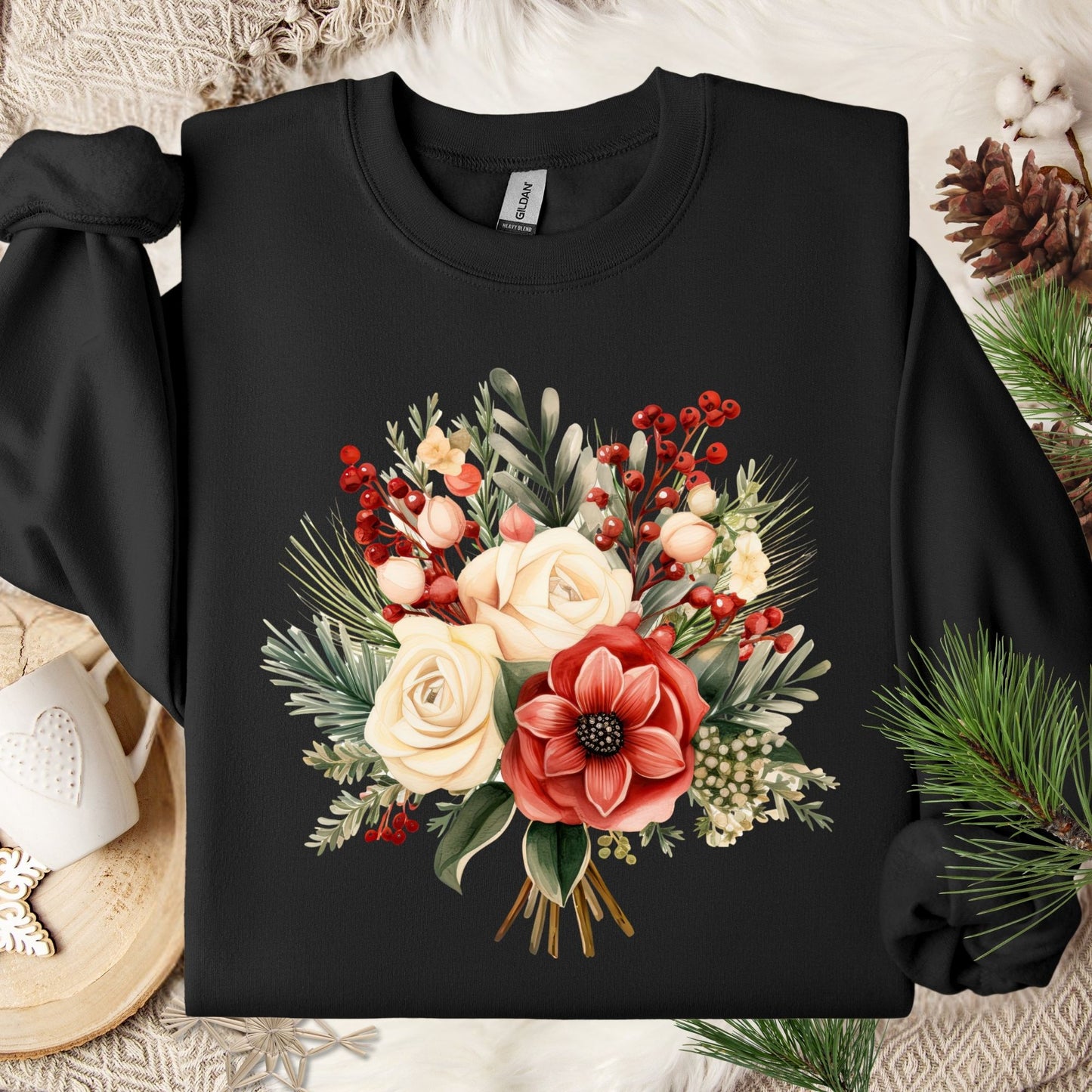 Black Gildan sweatshirt with a watercolor Christmas bouquet of red, cream, and green flowers and holly.