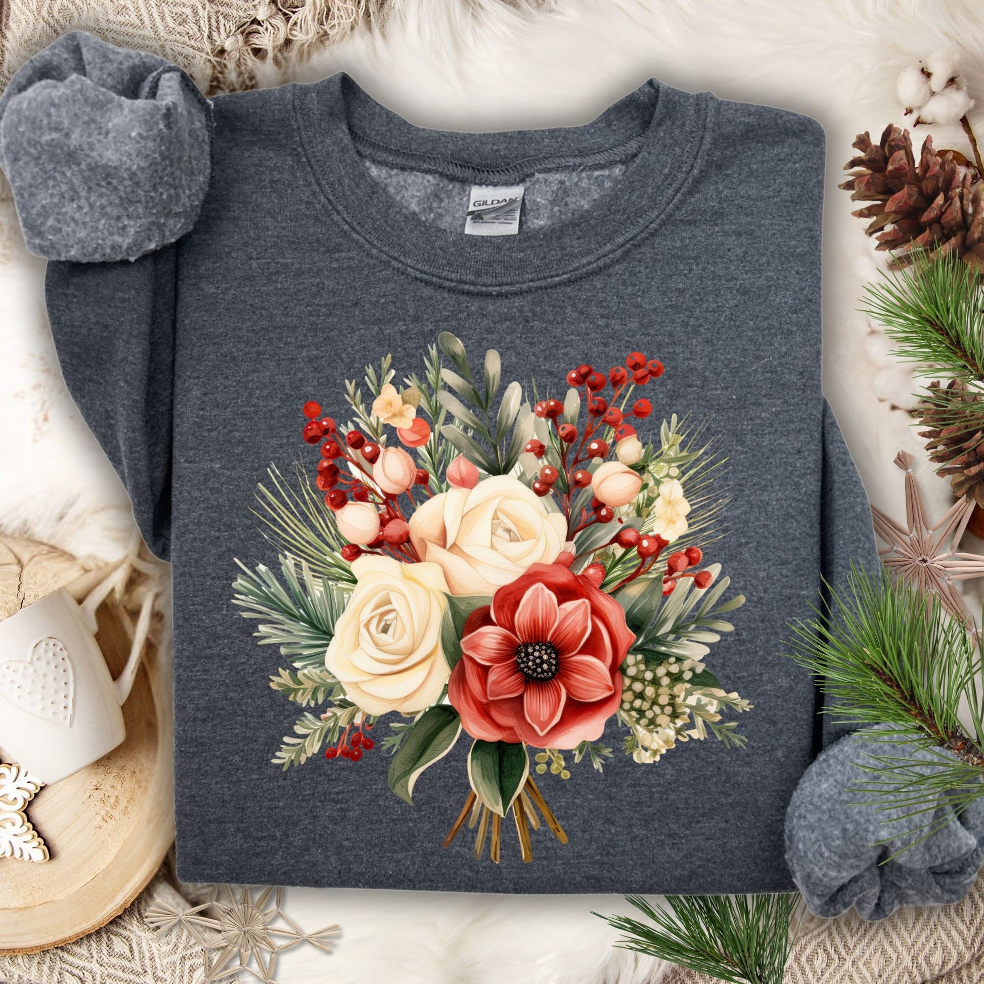 Dark heather Gildan sweatshirt with a watercolor Christmas bouquet of red, cream, and green flowers.