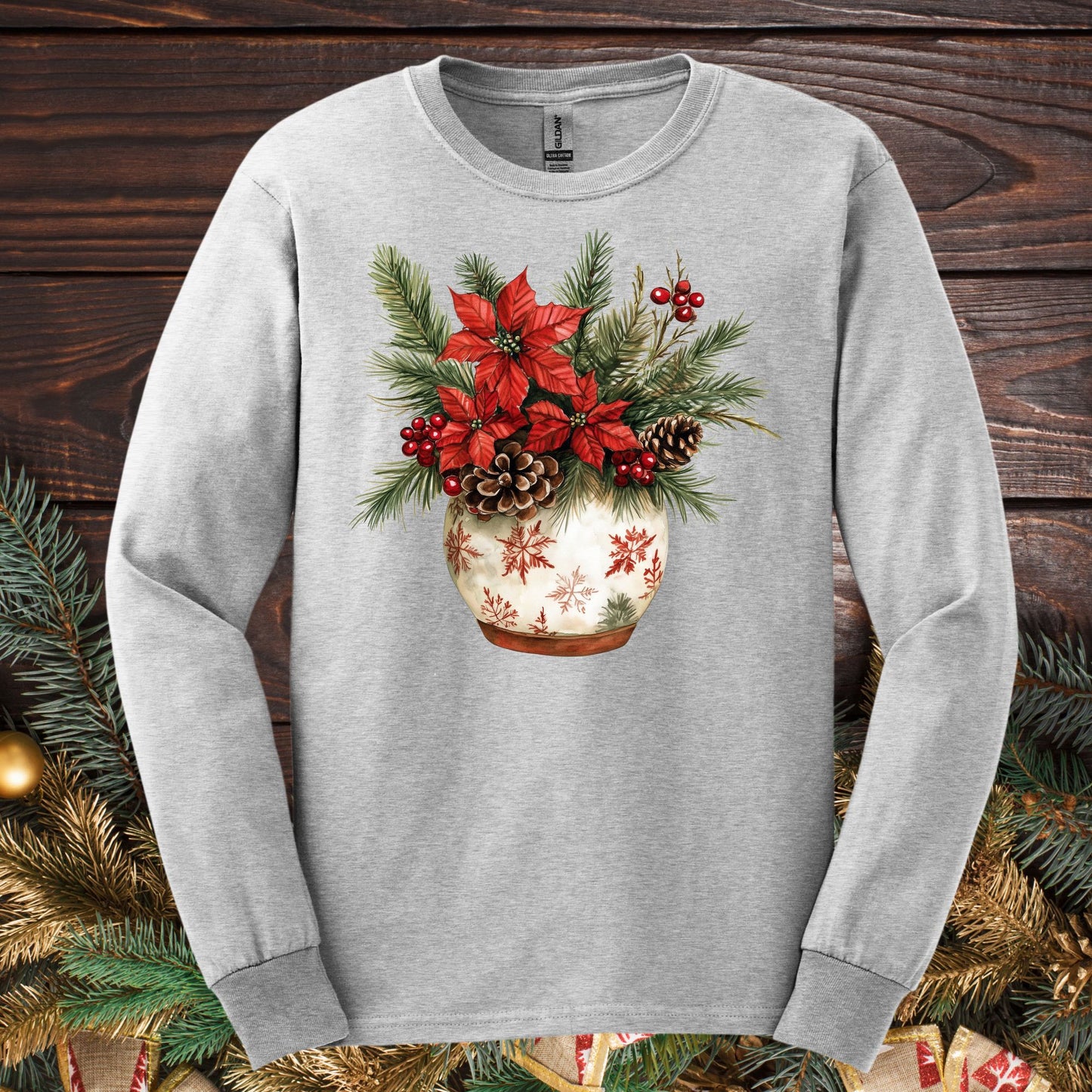 Ash gray Gildan long sleeve tee with a watercolor holiday floral arrangement in a snowflake ceramic pot.