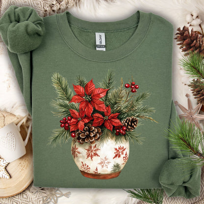 Military Green Gildan long sleeve tee with watercolor poinsettia, pinecone, and holly arrangement in snowflake pot.