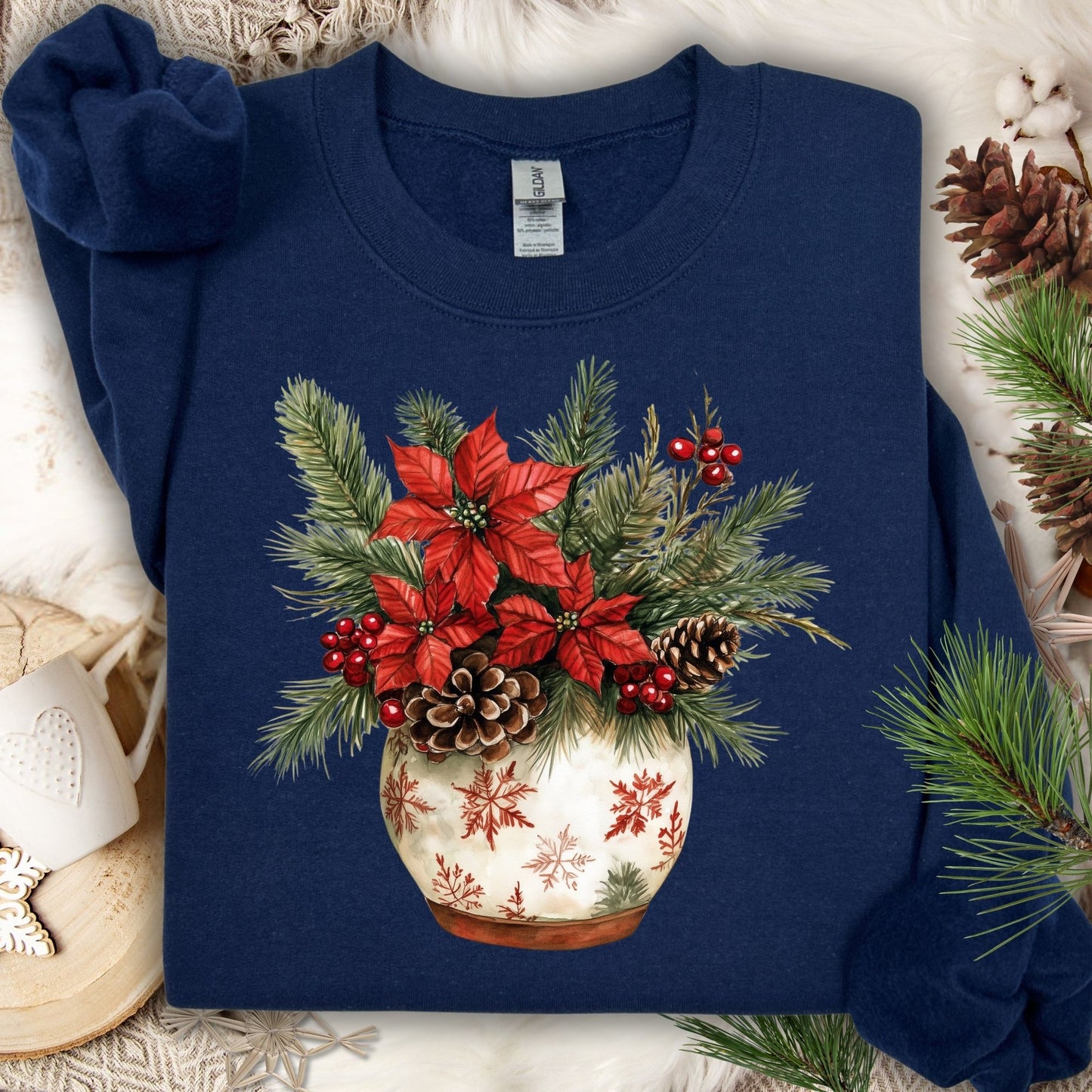 Navy Gildan long sleeve tee with watercolor holiday floral arrangement in snowflake ceramic pot.
