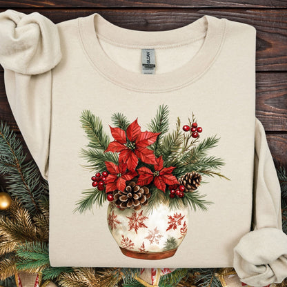 Sand Gildan long sleeve tee with watercolor holiday floral arrangement in snowflake pot.