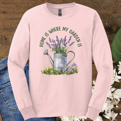 Light pink long sleeve tee, size S, with a watercolor watering can, lavender, and "home is where my garden is" text.