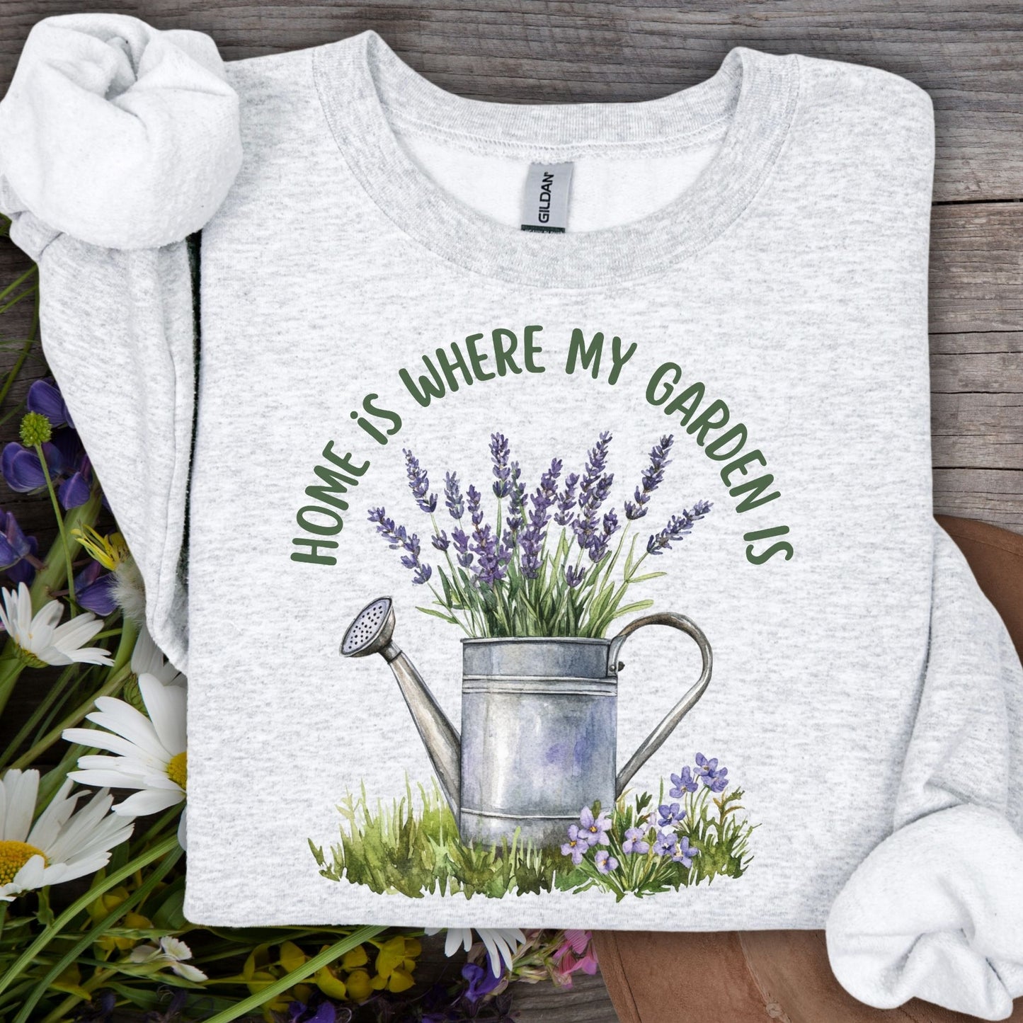 Ash grey unisex sweatshirt with "Home is where my garden is" and a watercolor lavender watering can.
