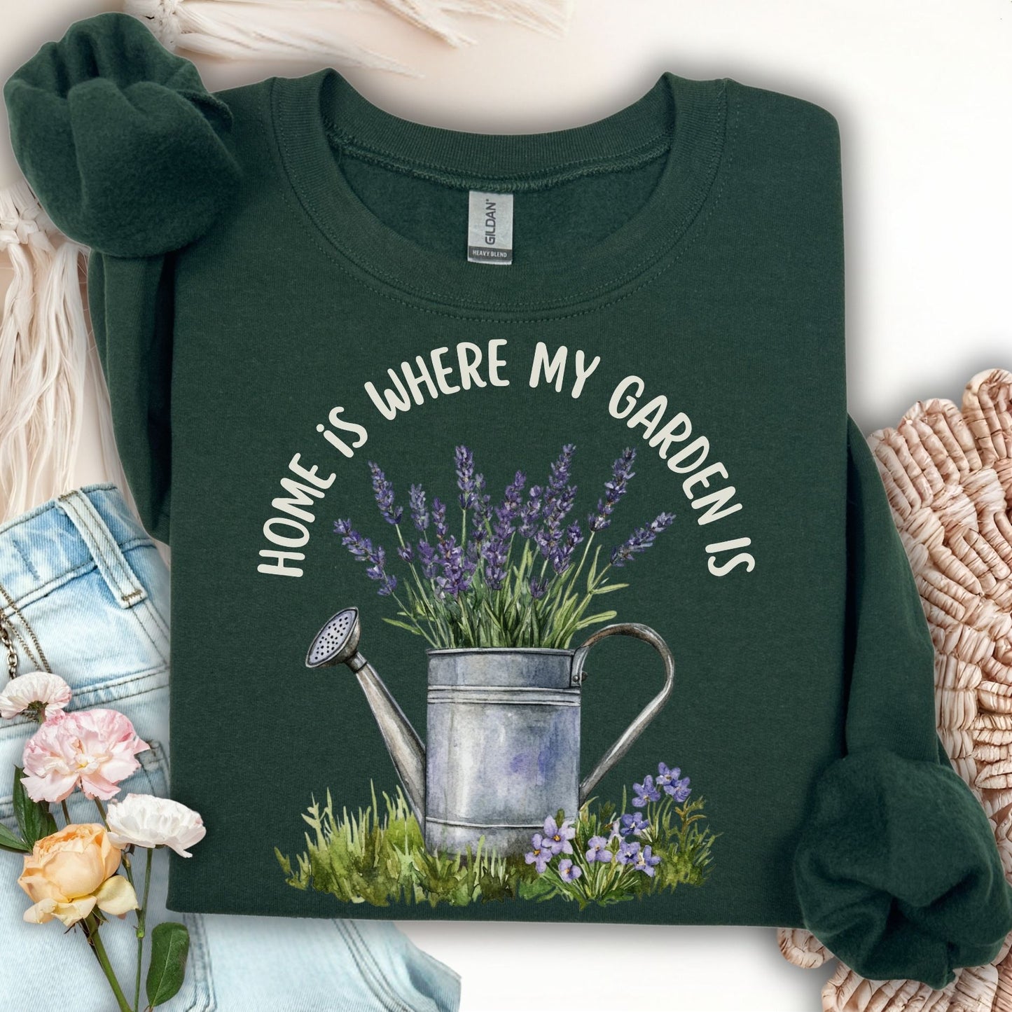 Forest Green unisex sweatshirt with "Home is where my garden is" text and a watercolor lavender watering can.