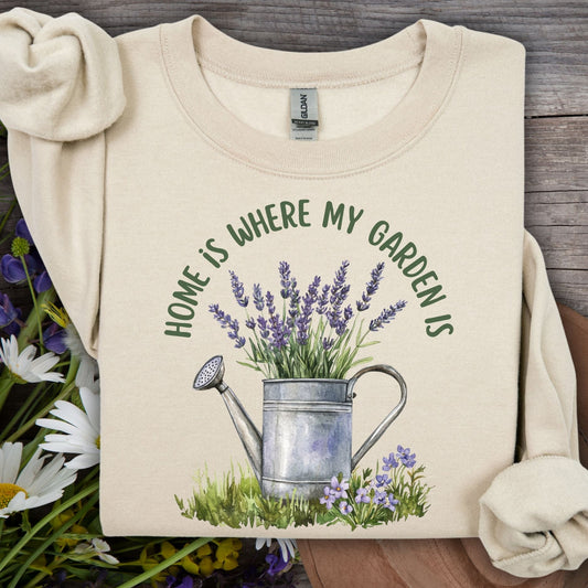 Sand unisex sweatshirt with "Home is where my garden is" text and a watering can with lavender.
