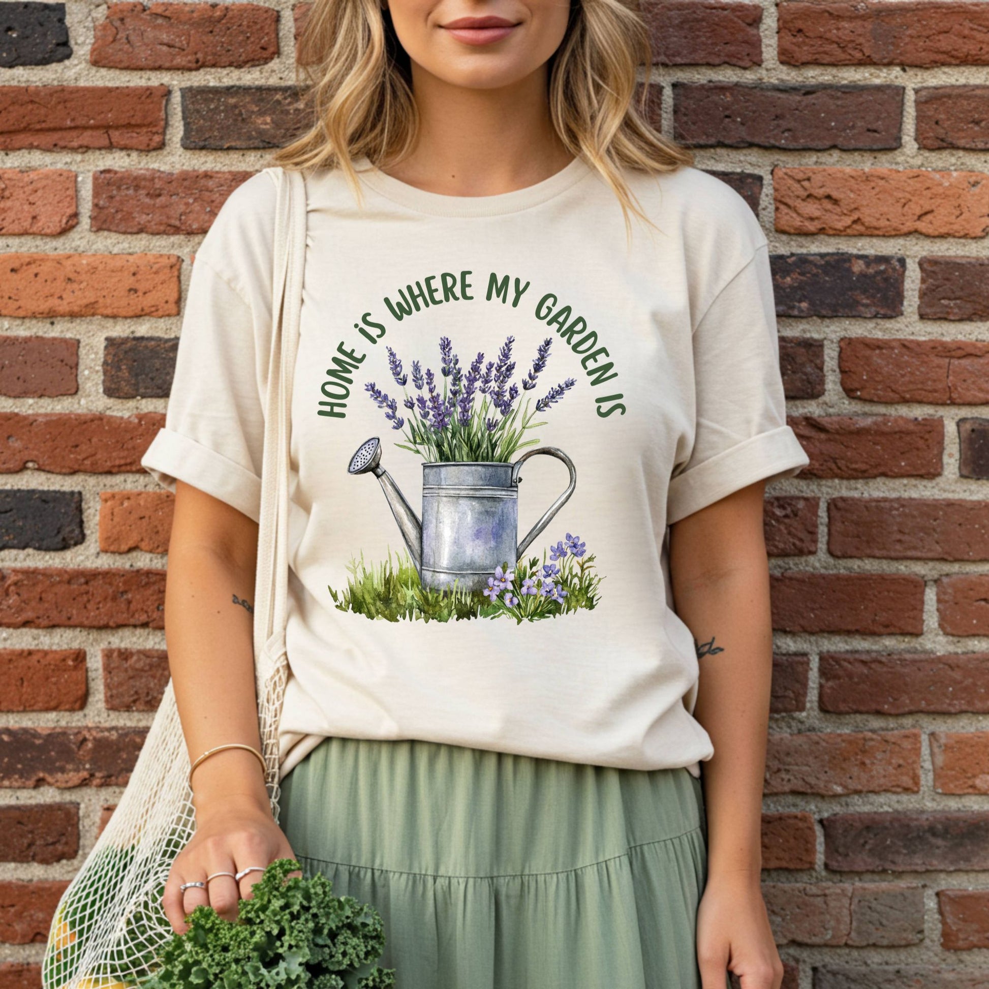 Relaxed-fit, garment-dyed t-shirt with a watercolor watering can overflowing with lavender.