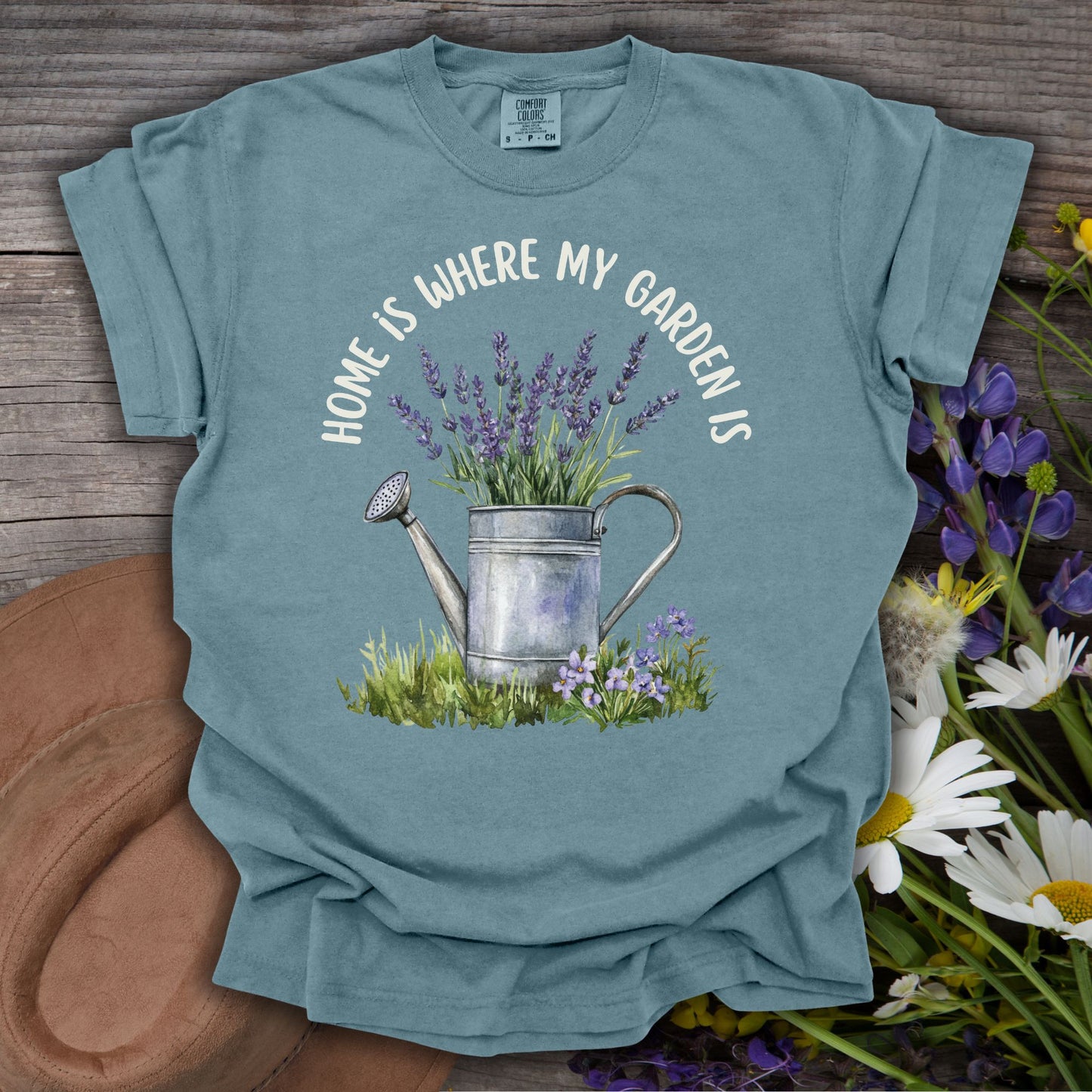 Ice Blue S t-shirt with a watercolor watering can overflowing with lavender and "Home Is Where My Garden Is" text.