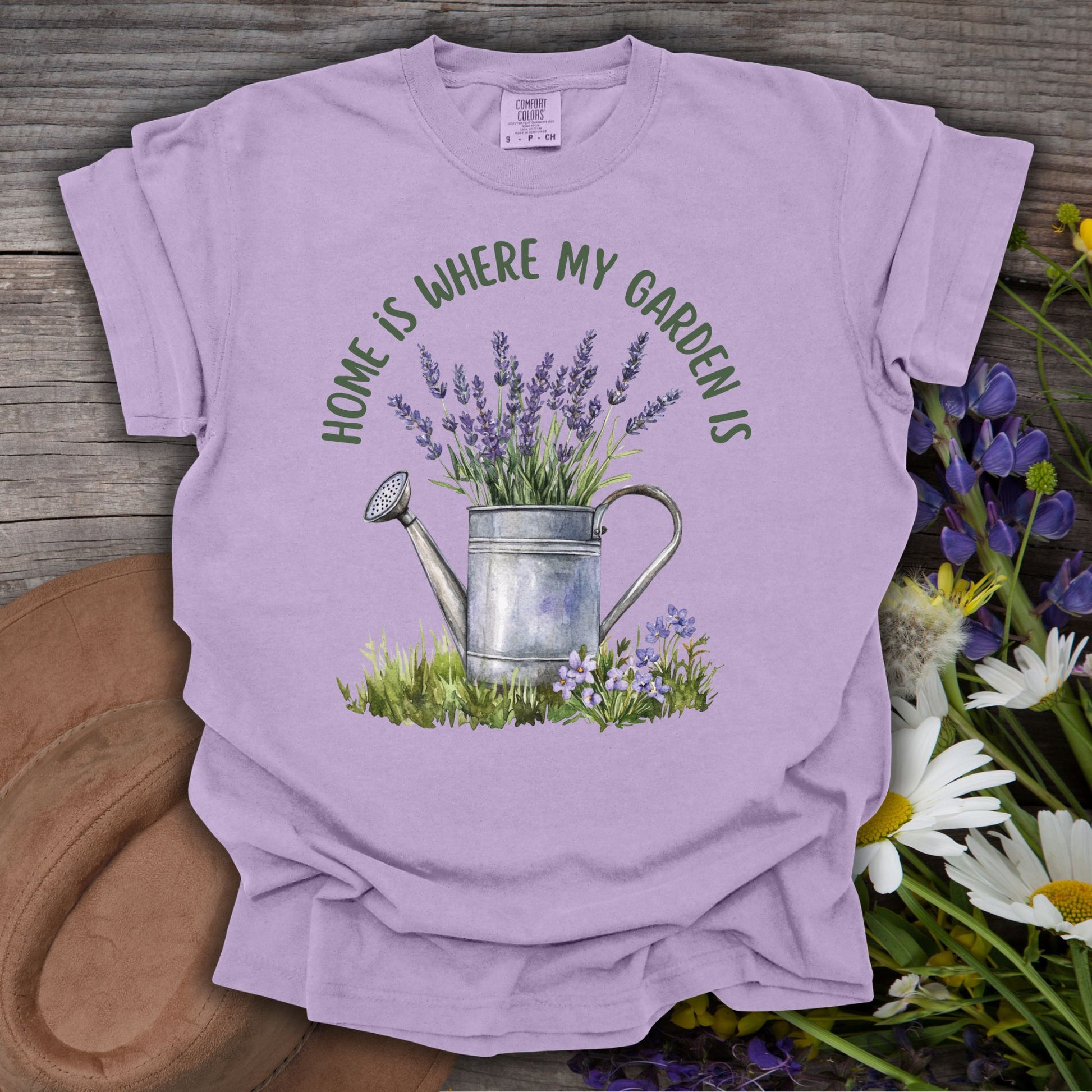 Orchid S t-shirt with a watercolor watering can overflowing with lavender and "Home Is Where My Garden Is" text.