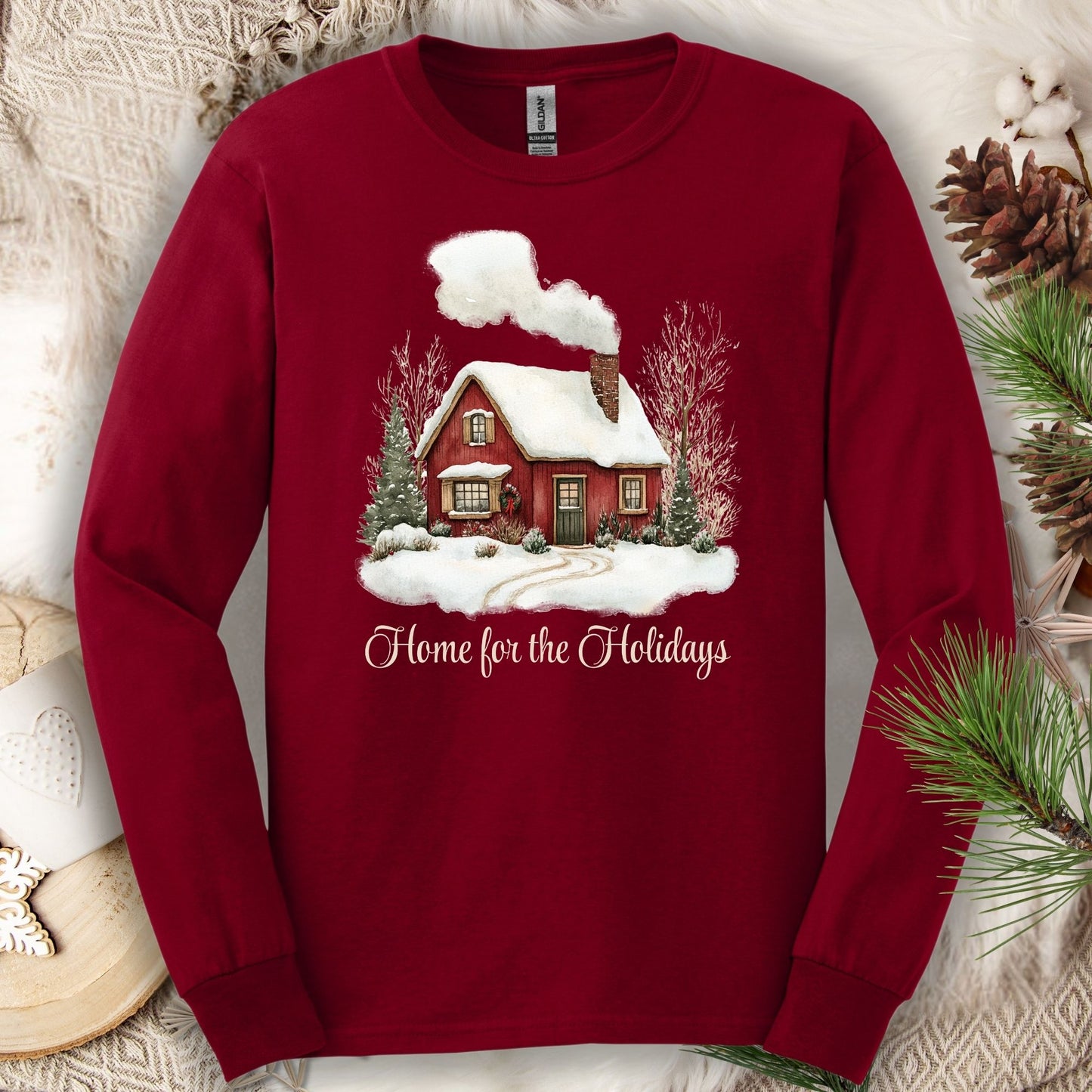 Cardinal Red Gildan Softstyle long sleeve tee with watercolor winter cabin and "Home for the Holidays" script.