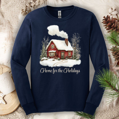 Navy long sleeve tee with a watercolor red winter cabin, evergreens, and "Home for the Holidays" script.