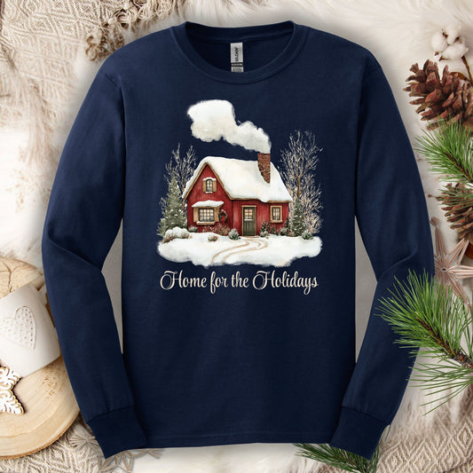 Navy long sleeve tee with a watercolor red winter cabin, evergreens, and "Home for the Holidays" script.
