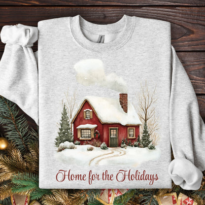Ash Gildan sweatshirt with vintage watercolor red cabin and "Home for the Holidays" text.