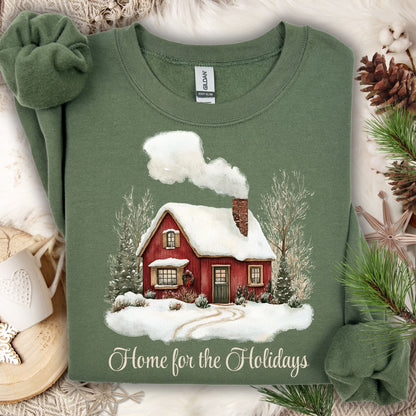 Military Green Gildan sweatshirt with vintage watercolor red cabin and "Home for the Holidays" text.