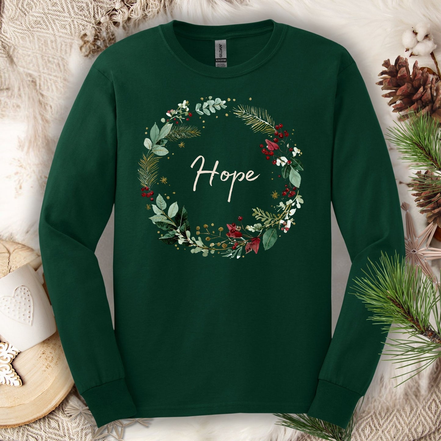 Forest Green long sleeve tee with a watercolor Christmas wreath and "Hope" at its center.