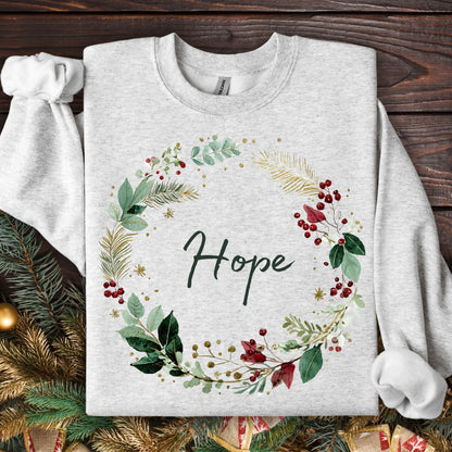 Ash Gildan sweatshirt with watercolor "Hope" Christmas wreath in green, cream, gold, and red berries.