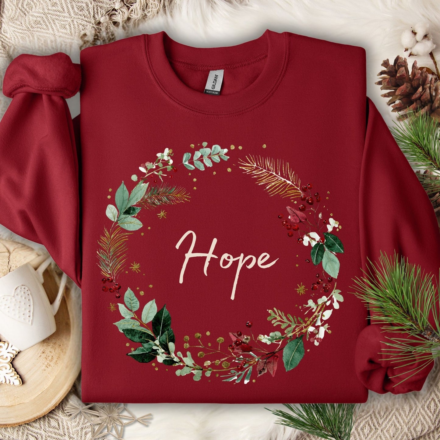 Cardinal Red Gildan sweatshirt with a watercolor Christmas wreath and "Hope" in cream script.