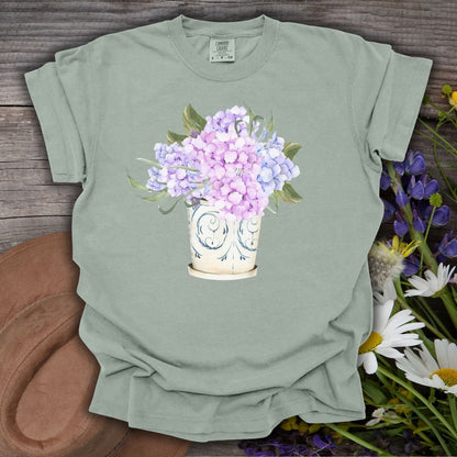Bay green t-shirt with a watercolor hydrangea bouquet in a vintage ceramic vase.