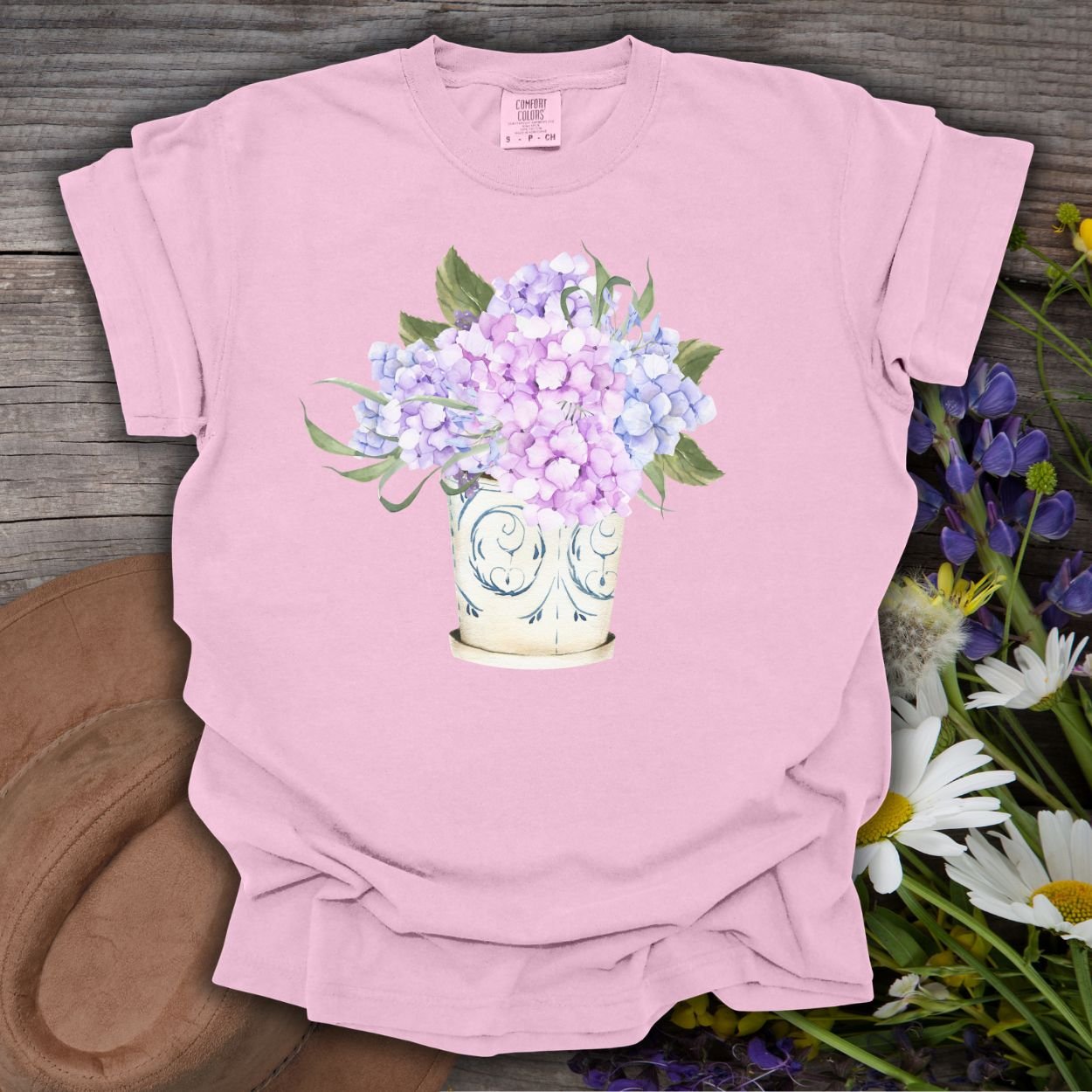Blossom pink garment-dyed t-shirt with a watercolor hydrangea bouquet in a vintage ceramic vase.