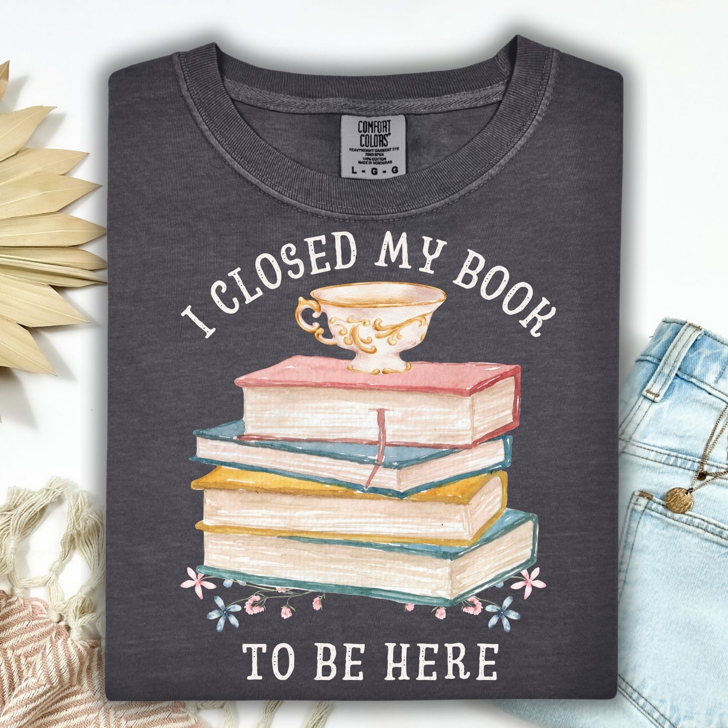 Pepper Comfort Colors t-shirt with "I Closed My Book To Be Here" text, watercolor books, teacup, and florals.