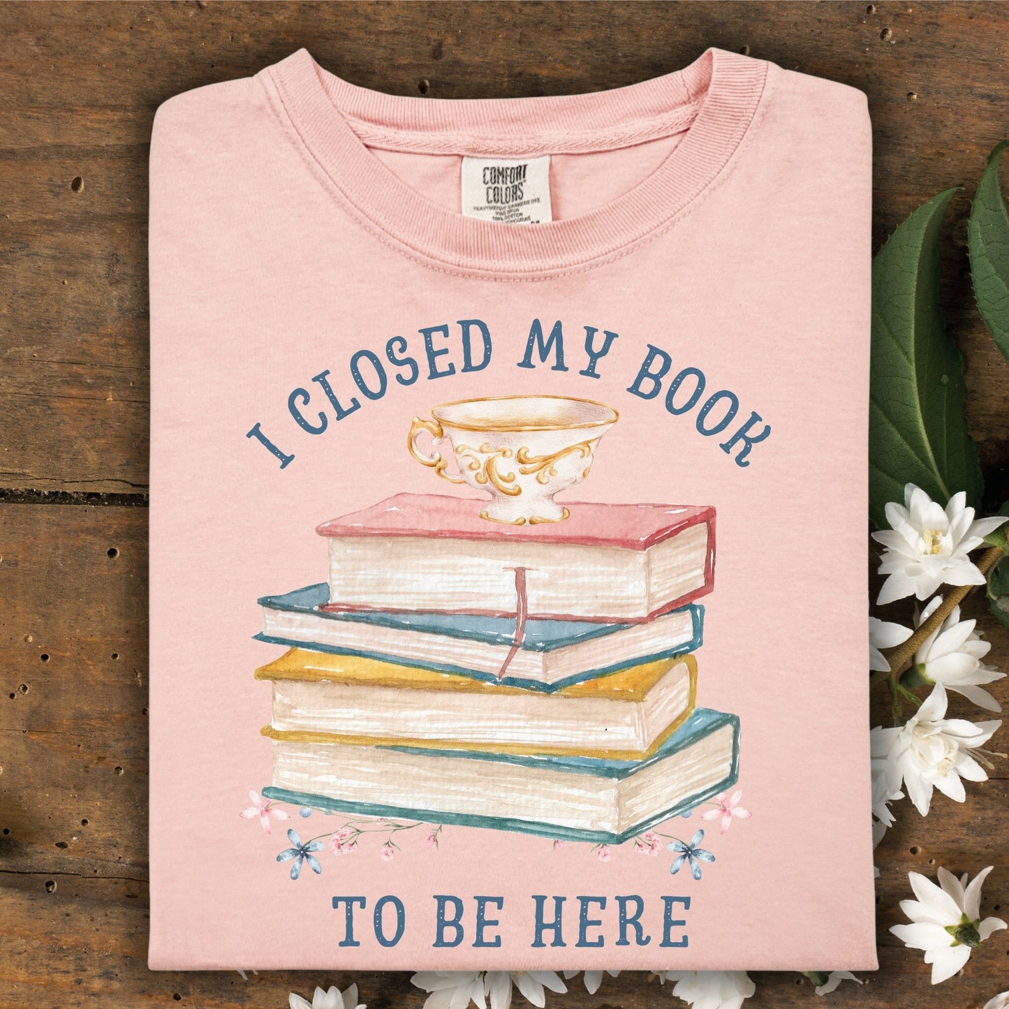 Peachy Comfort Colors t-shirt with "I Closed My Book To Be Here" text, watercolor books, teacup, and florals.