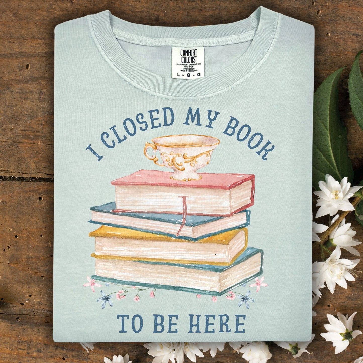 Bay Comfort Colors tee with "I Closed My Book To Be Here" text, watercolor books, teacup, and florals.