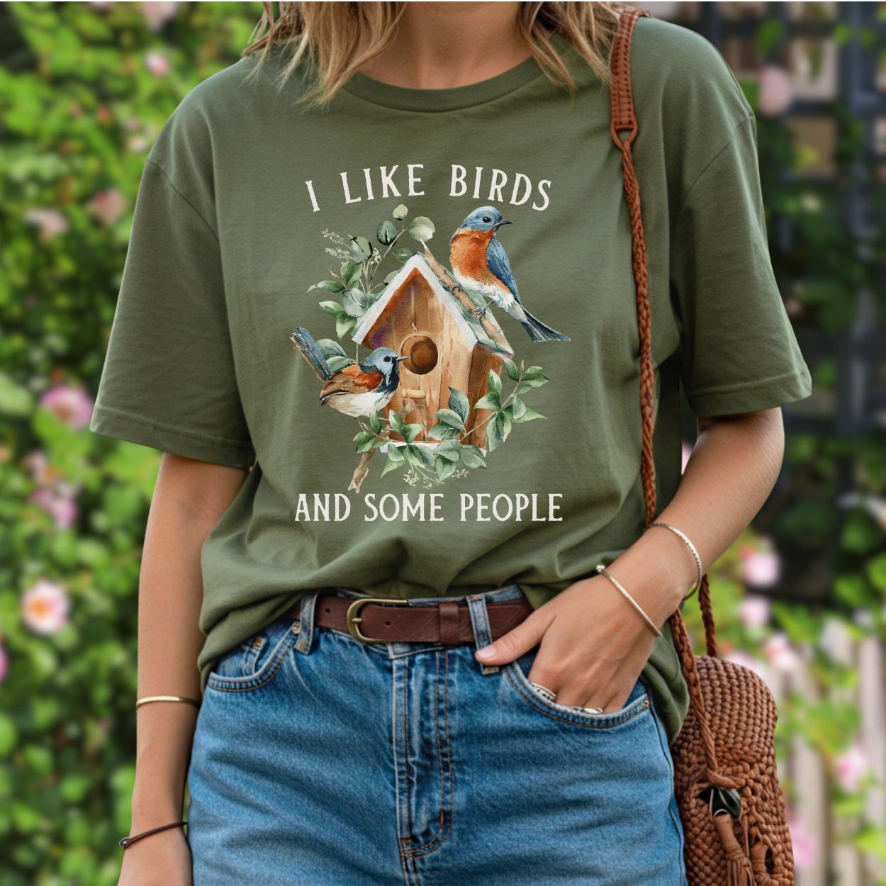 Olive green "I Like Birds and Some People" t-shirt with bluebirds and birdhouse graphic.