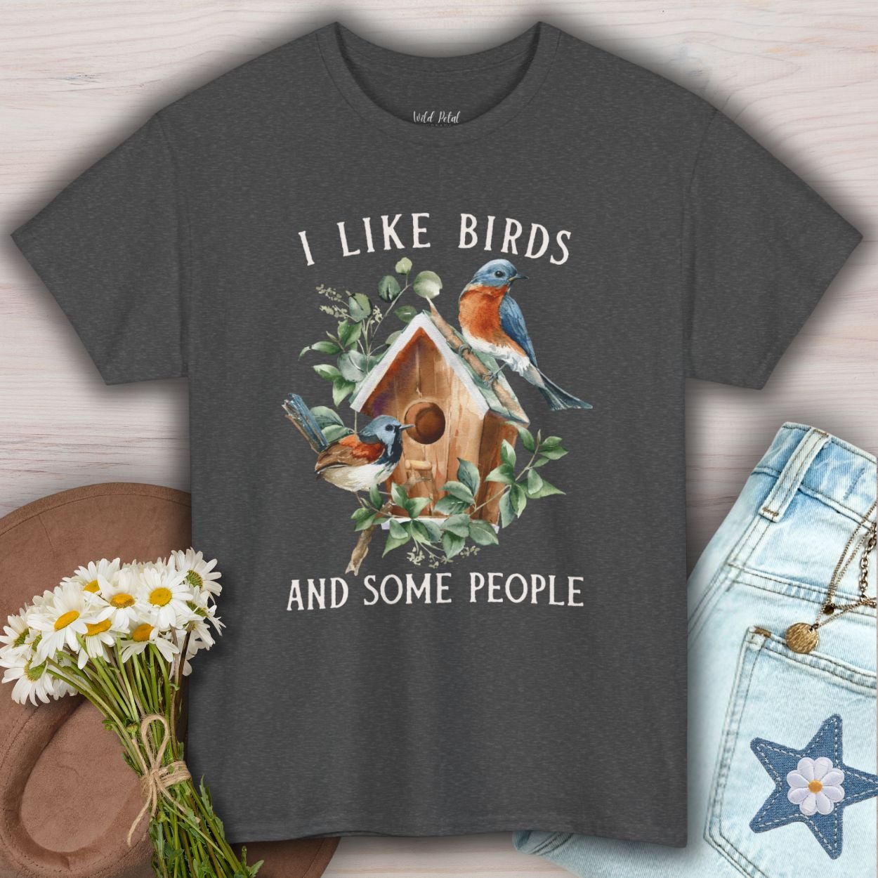 Dark Heather S-size t-shirt with "I like birds and some people" text, birdhouse, and bluebird watercolor graphic.
