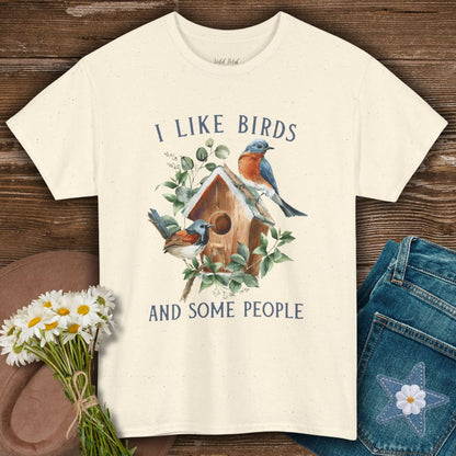 Natural cotton t-shirt with "I like birds and some people" text and watercolor bluebirds on a birdhouse.