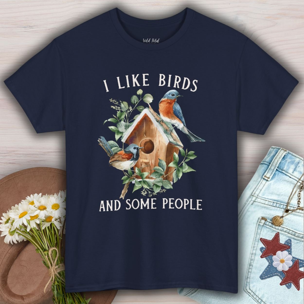 Navy "I Like Birds and Some People" T-shirt with watercolor bluebirds on a birdhouse.