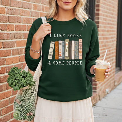 Dark green Gildan crewneck sweatshirt with "I like books & some people" and vintage book graphic.