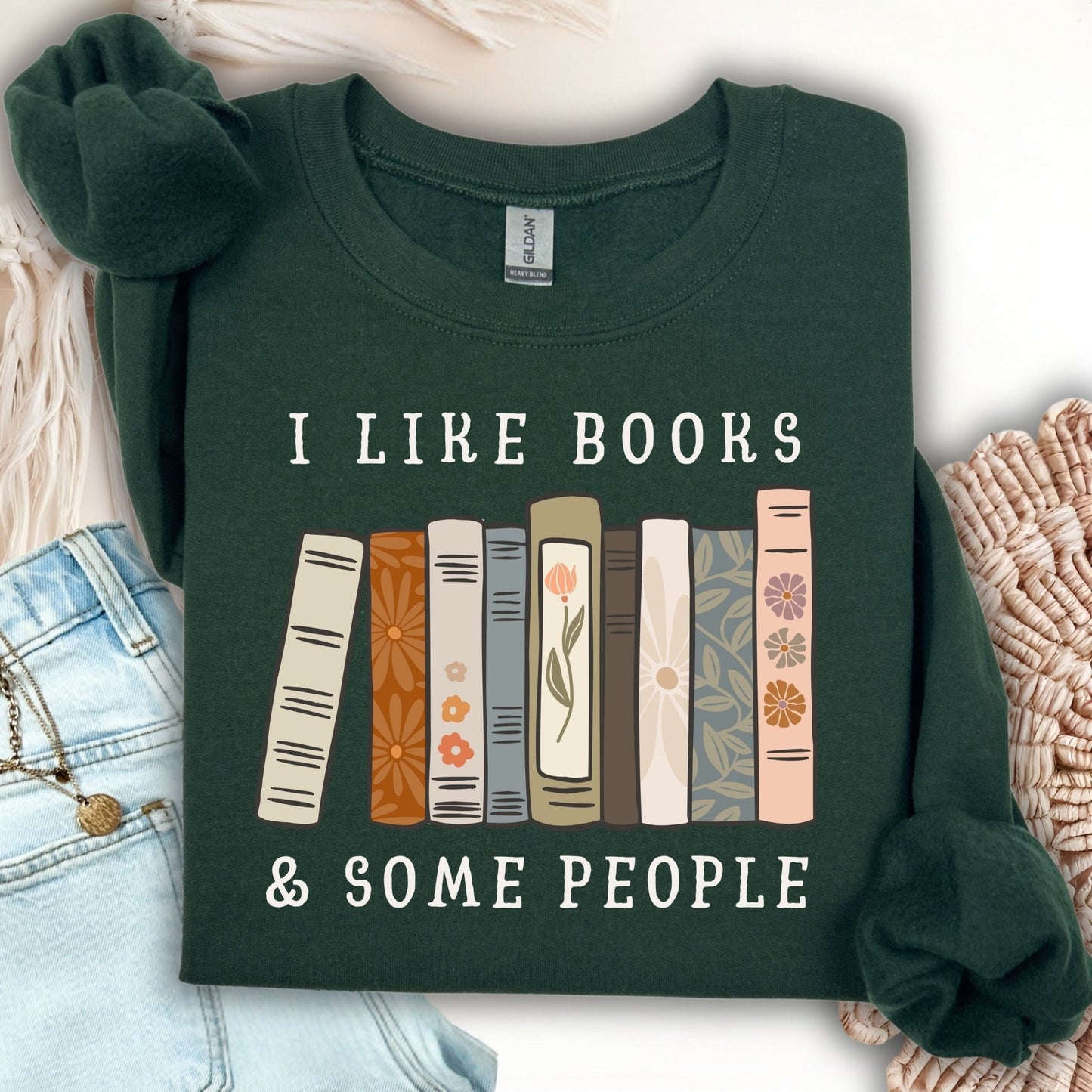 Forest Green Gildan crewneck sweatshirt with "I like books & some people" text above a row of vintage books.