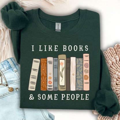 Forest Green Gildan crewneck sweatshirt with "I like books & some people" text above a row of vintage books.