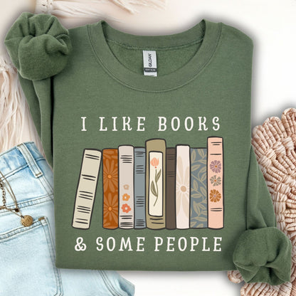 Military Green Gildan sweatshirt with "I like books & some people" and a row of vintage books graphic.
