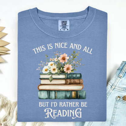 Blue Jean Comfort Colors t-shirt with "This is nice and all but I'd rather be reading" text and vintage books with wildflowers.