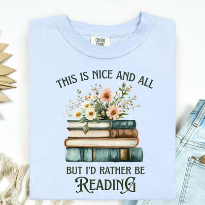 Hydrangea blue Comfort Colors t-shirt with "This is nice and all but I'd rather be reading" text and vintage book stack with wildflowers.